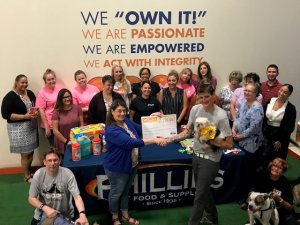 Phillips employees present checks, food and supplies to Peaceable Kingdom